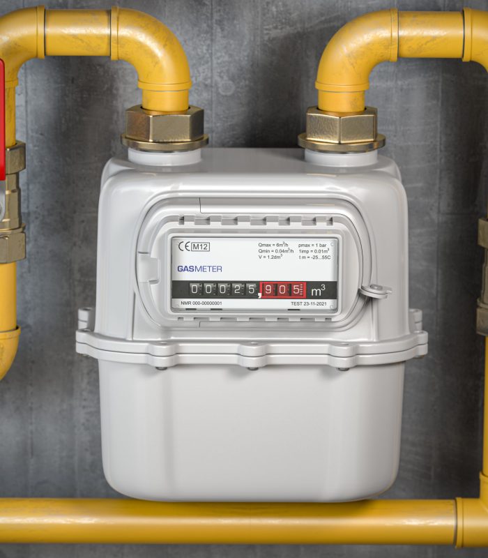 Natural gas meter with tubes on the wall. Gas en castellón